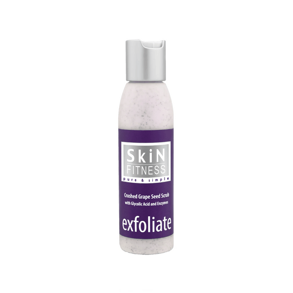 Bottle of Crushed Grapeseed Scrub | Skin Fitness Therapy featuring exfoliating formula with glycolic acid and enzymes for gentle skincare and body care.
