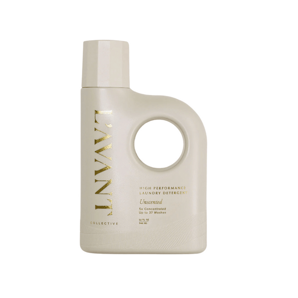 Bottle of High Performing Laundry Detergent - Unscented | L'AVANT Collective featuring a minimalist beige design and gold lettering highlighting its concentrated formula.