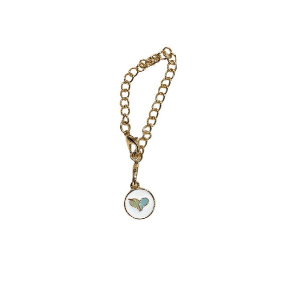 Gold chain tumbler charm with a small round pendant featuring a blue heart and wing design, part of the Tumbler Charm | Live Love Spa collection.