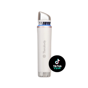 TheraFace Depuffing Wand | Therabody sleek white and silver skincare device designed for targeted facial depuffing and enhancing wellness routines