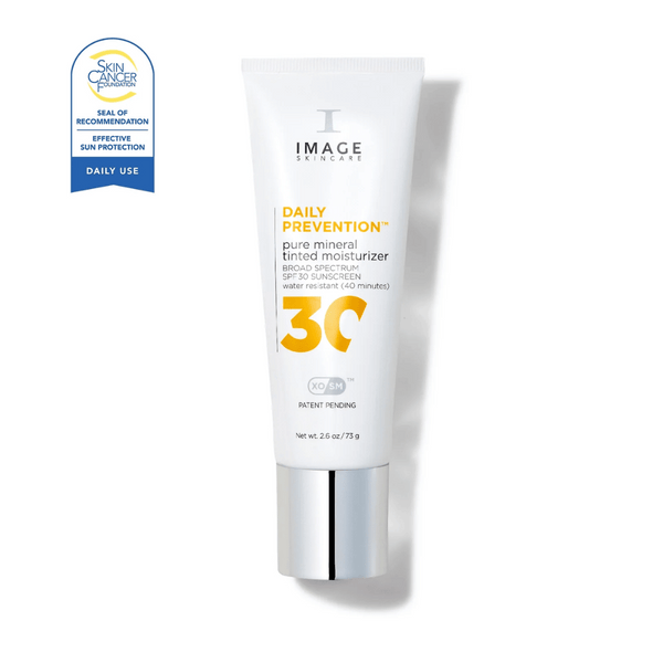 Tube of DAILY PREVENTION pure mineral tinted moisturizer SPF 30 | IMAGE Skincare with broad spectrum sun protection and water resistance, featuring a Skin Cancer Foundation seal.