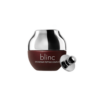 Eye Repair Peptide Complex | blinc in a sleek dark brown jar with a shiny silver cap and applicator, designed for targeted skincare around the eyes.