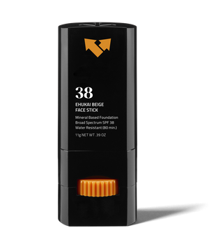 Ehukai Beige Sunscreen Face Stick SPF 38 | Vertra in a sleek black container with orange twist dial, mineral-based foundation offering broad spectrum SPF 38 protection for skincare.