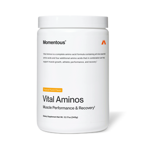 White container of Vital Aminos dietary supplement by Momentous with tropical punch flavor, designed to support muscle performance and recovery.