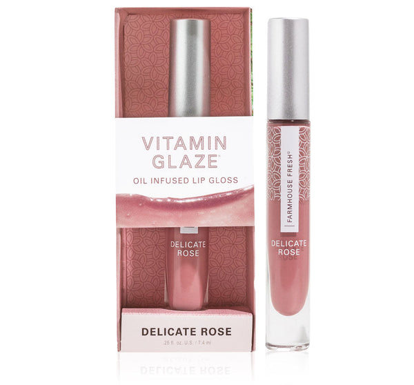 Vitamin Glaze® Oil Infused Lip Gloss – Delicate Rose | Farmhouse Fresh in soft rosy pink shade with sleek silver cap and patterned packaging for skincare and body care wellness.