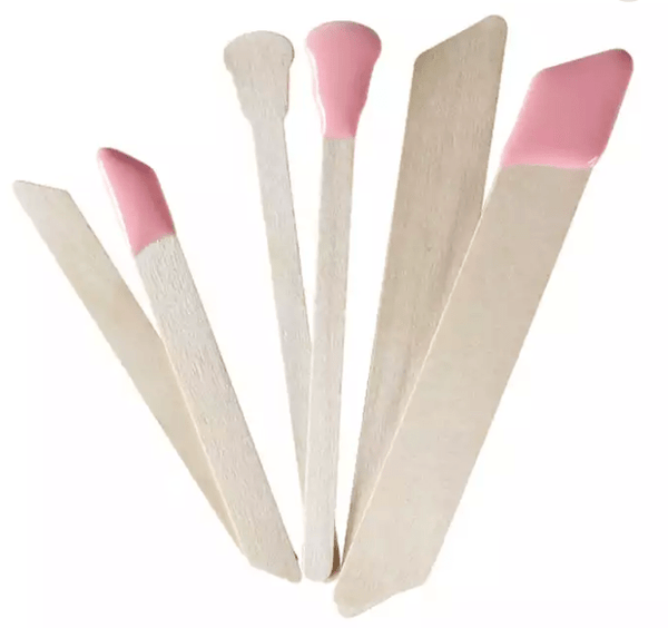 Set of wooden applicators with pink silicone tips designed for skincare and body care, featured in Get a Grip Face & Body Applicators | Crybaby Wax.