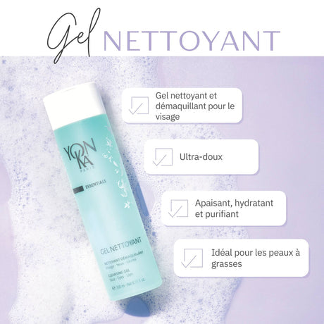 Bottle of Gel Nettoyant Cleanser | Yon-Ka Paris lying on a surface with foamy cleanser around it, highlighting its gentle, soothing, hydrating, and purifying skincare benefits.