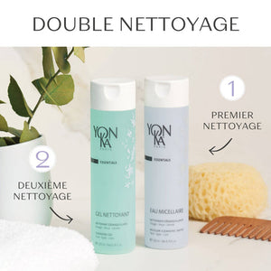 Two Yon-Ka Paris skincare bottles, including Gel Nettoyant Cleanser | Yon-Ka Paris, displayed alongside a natural sponge, wooden comb, and towel for a gentle double cleansing routine.