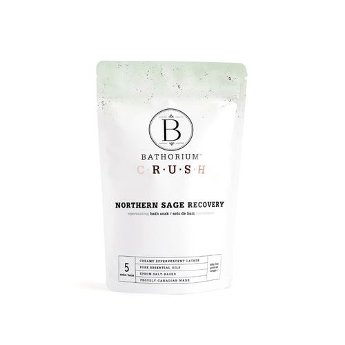 Packaging of Northern Sage Recovery Crush | Bathorium, a bath soak product designed for rejuvenating skincare and body care, featuring clean white and light green colors with essential oils and Epsom salt blend.