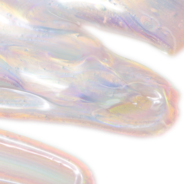 Close-up of iridescent skincare gel texture showcasing smooth, translucent layers with subtle pink and purple hues, representing Crystal Dew Drops For Eyes & Lips | Skin Fitness Therapy.