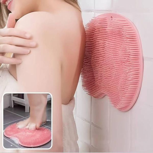 Back & Foot Scrubber | Dreambox Beauty mounted on a tiled wall with soft pink silicone bristles, used for easy self-scrubbing of back and feet to enhance skincare and body care routines.