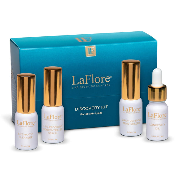 Discovery Kit | LaFlore featuring four skincare products with white bottles and gold caps, designed for all skin types to enhance wellness and probiotic skincare.