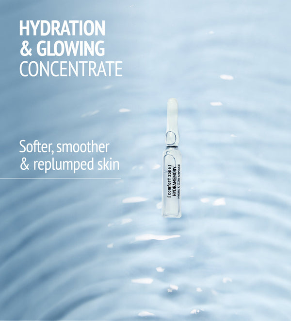Single clear ampoule floating on soft rippling water surface with text highlighting hydration and glowing concentrate for softer, smoother, and replumped skin by Hydramemory Hydra & Glow Ampoules | [ comfort zone ].