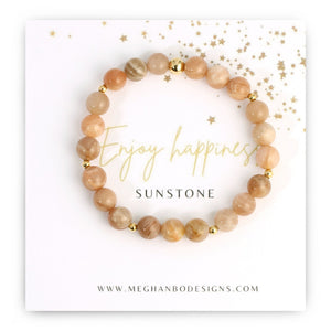 Joy Intention Bracelet | Meghan Bo featuring polished sunstone beads with gold accents displayed on a card with an uplifting message for wellness and joy.