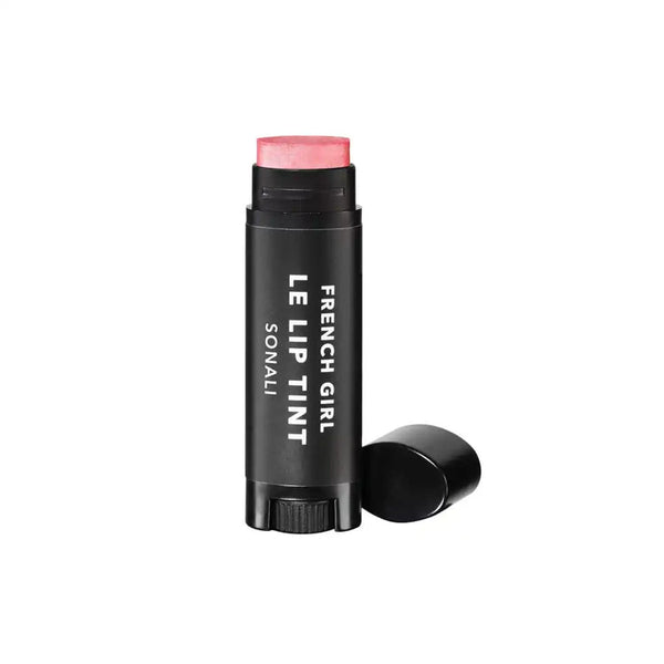 Le Lip Tint | French Girl in a sleek black tube with the cap removed, showing a soft pink tinted balm for natural lip color enhancement.
