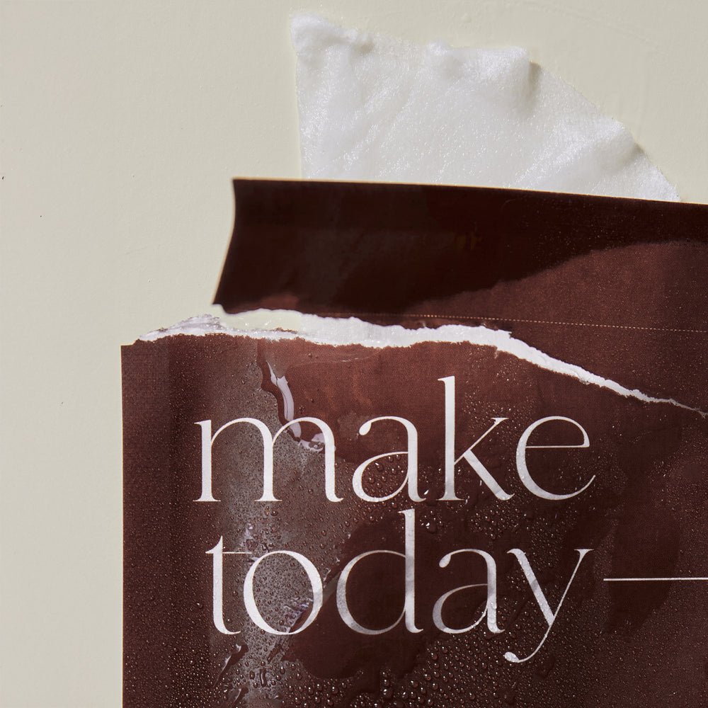 Korean Sheet Mask - Make Today Amazing | Lucky Owl packaged in a brown biodegradable pouch promoting detoxifying, vegan, gluten-free skincare with natural essences for a refreshing spa experience.