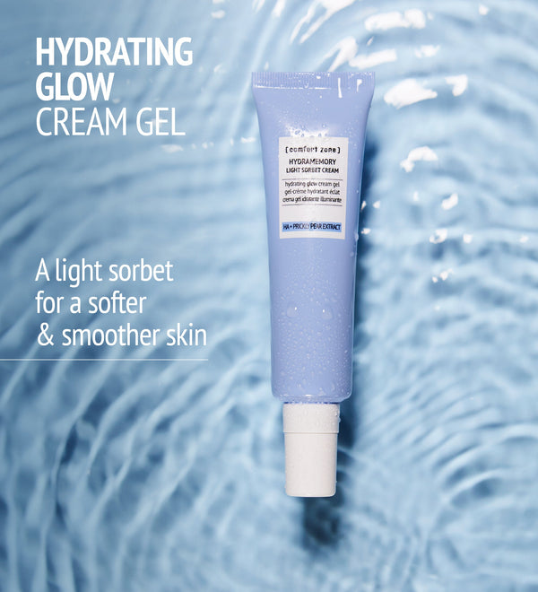 Hydramemory Light Sorbet Cream | [ comfort zone ] in a lavender tube with water droplets on a ripple water background promoting hydrating glow cream gel for softer and smoother skin.