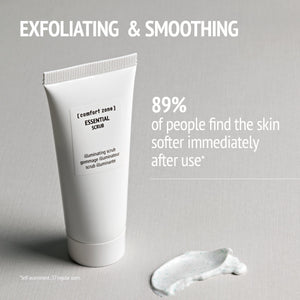 Tube of Essential Scrub | [ comfort zone ] displayed next to a small amount of textured exfoliating scrub cream on a neutral background, highlighting its exfoliating and smoothing benefits.