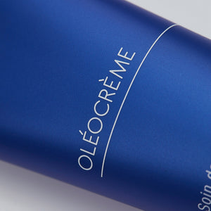 Close-up of a sleek blue tube labeled Olécrème Hand Cream | Phytomer, showcasing premium skincare packaging designed for hand care and hydration.