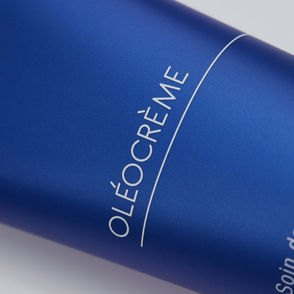 Close-up of a sleek blue tube labeled Olécrème Hand Cream | Phytomer, showcasing premium skincare packaging designed for hand care and hydration.
