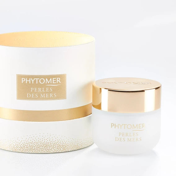 Perles Des Mers Longevity Cream | Phytomer in a frosted glass jar with gold lid next to a matching white and gold decorative packaging, showcasing premium skincare.