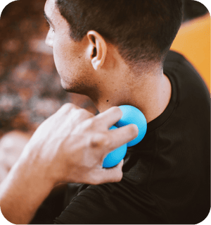 Person using a blue RAD Roller Soft | RAD massage tool on the back of their neck for muscle relief and wellness recovery.