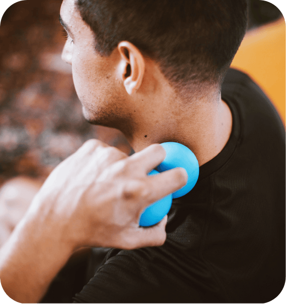 Person using a blue RAD Roller Soft | RAD massage tool on the back of their neck for muscle relief and wellness recovery.