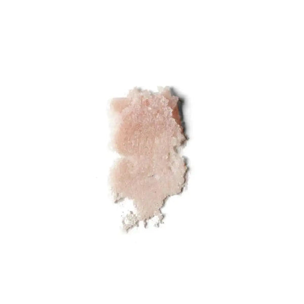 Swatch of a soft pink lip polish with a slightly glossy, creamy texture labeled Rose LIp Polish | French Girl for skincare and beauty use.