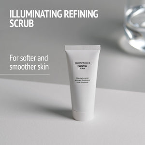 Tube of Essential Scrub | [ comfort zone ] displayed on a light surface with text highlighting its illuminating refining scrub benefits for softer and smoother skin in skincare and body care.