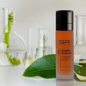 Whitening Peeling Acid | SR Cosmetics skincare product in an amber bottle with black cap, displayed with green leaf and laboratory glassware for a natural and scientific wellness theme.