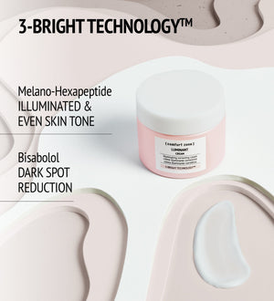 Luminant Cream | [ comfort zone ] jar with white cream swatch on a sculpted beige surface highlighting 3-Bright Technology for illuminated, even skin tone and dark spot reduction skincare benefits.