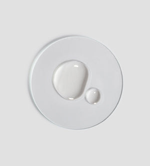 Clear droplets of Renight Oil | [ comfort zone ] skincare product displayed on a white surface highlighting its lightweight, nourishing texture ideal for body care and wellness.
