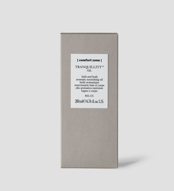 Packaging box of Tranquillity Oil (Bath & Body) | [ comfort zone ] in neutral tones, designed for aromatic skincare and body care products promoting relaxation.