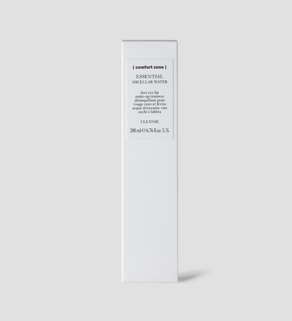 White rectangular box packaging of Essential Micellar Water | [ comfort zone ] for skincare, featuring minimalistic design and product details on a light gray background.