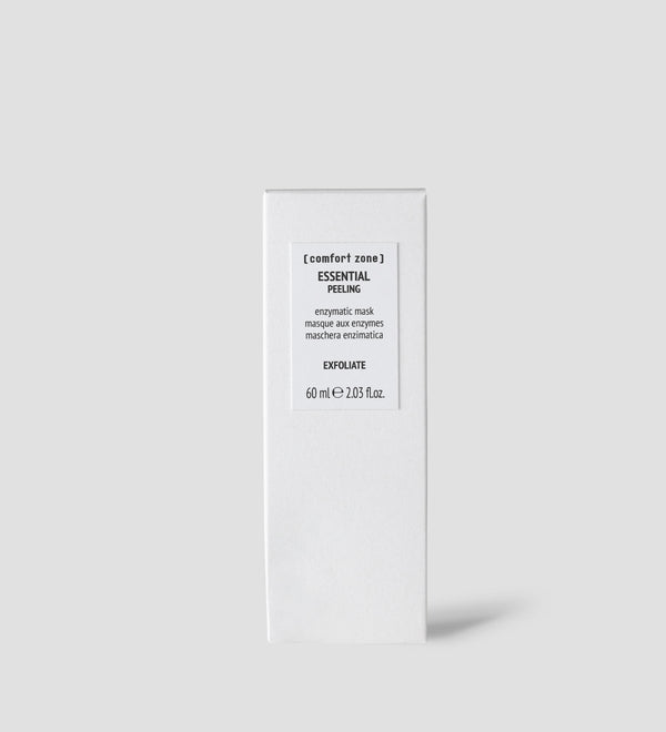 Minimalist white packaging of Essential Peeling | [ comfort zone ], an enzymatic mask for exfoliating skincare, displayed against a light gray background for a clean wellness aesthetic.