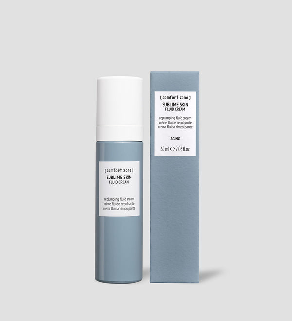 Sublime Skin Fluid Cream | [ comfort zone ] in a sleek blue and white bottle next to its matching box, designed for skincare and anti-aging purposes.