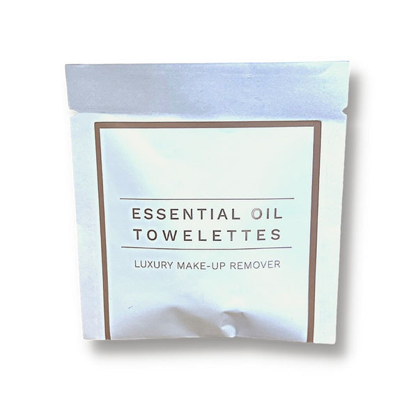 White packet of Essential Oil Towelettes luxury make-up remover wipes shown against a white background, featuring the product Make Up Remover Wipes | Functional Botanicals for skincare use.
