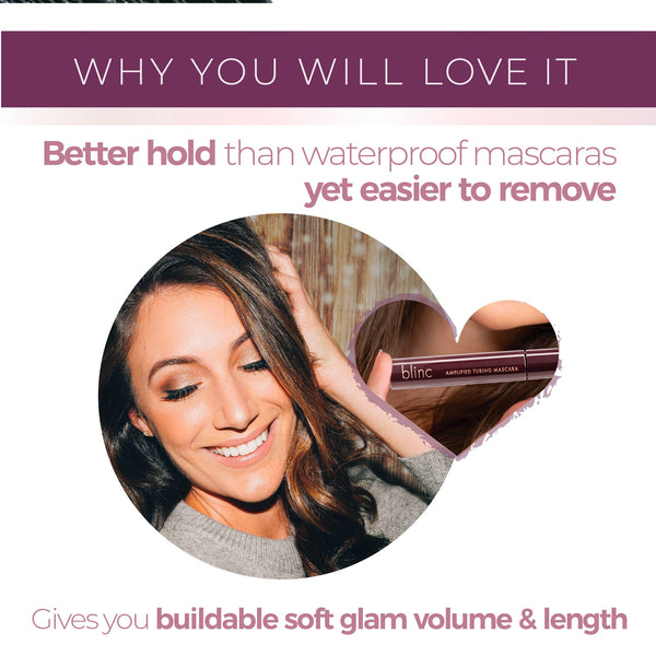 Smiling woman with styled hair showcases long, voluminous lashes enhanced by Amplified Tubing Mascara | Blinc, pictured in a sleek dark tube for buildable, soft glam look.