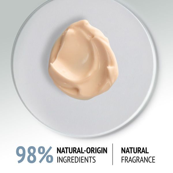 Creamy beige texture of Sublime Skin Fluid Cream | [ comfort zone ] displayed on a clear surface, highlighting its smooth consistency and natural skincare ingredients.