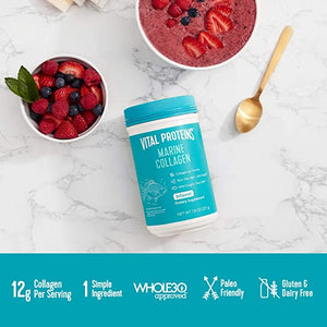 Container of Marine Collagen - Unflavored | Vital Proteins beside a bowl of mixed berries and a bowl of berry smoothie topped with sliced strawberries on a marble surface with a gold spoon nearby.