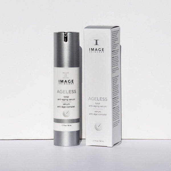 Bottle and box packaging of AGELESS total anti-aging serum | IMAGE Skincare displayed on a plain white background, highlighting the sleek silver and white design for skincare use.