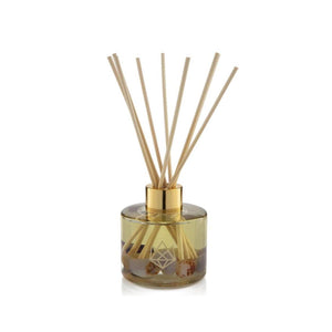 Energy Reed Diffuser | Aluminate Life with clear glass bottle, gold collar, natural reed sticks, and decorative stones, designed to enhance wellness and create a calming atmosphere.