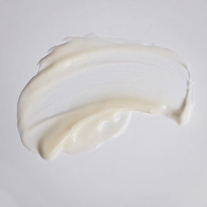 Smooth creamy white texture of Kantic® + Nourishing Cream | Alchimie Forever spread on a light surface, illustrating its rich skincare formula for hydration and nourishment.