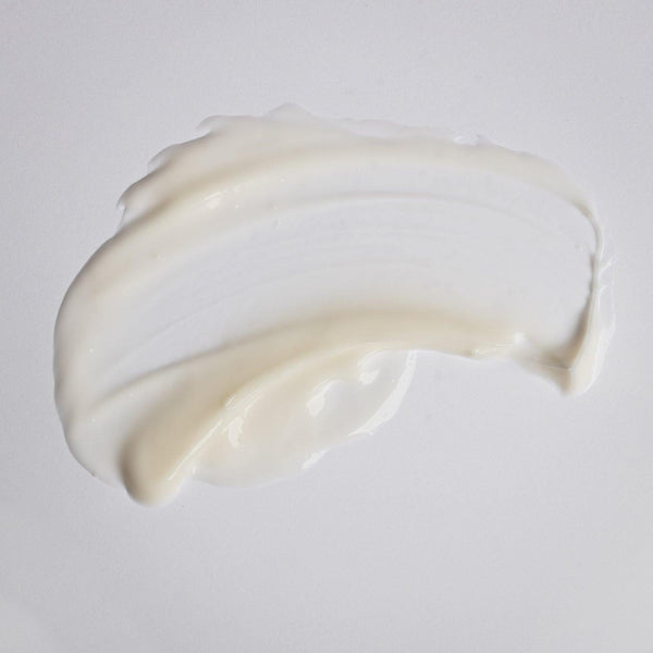 Smooth creamy white texture of Kantic® + Nourishing Cream | Alchimie Forever spread on a light surface, illustrating its rich skincare formula for hydration and nourishment.