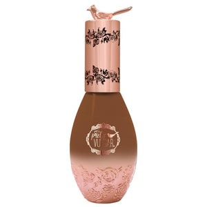 Elegant foundation bottle with a rose gold cap featuring a bird detail and floral designs, containing Cool AF Lava Water Foundation | Pretty Vulgar skincare product.