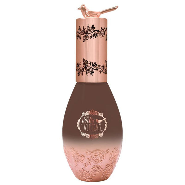 Elegant bottle of Cool AF Lava Water Foundation | Pretty Vulgar featuring rose gold cap with bird detail and intricate floral embossing, ideal for skincare and beauty routines.