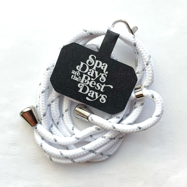 Crossbody Phone Lanyard With Adjustable Strap | Live Love Spa in white with silver accents, featuring a black tag that says "Spa Days are the Best Days.