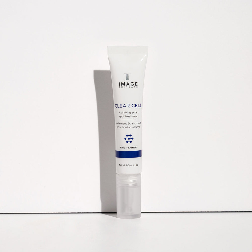 Tube of CLEAR CELL clarifying acne spot treatment | IMAGE Skincare featuring a white and blue design, intended for targeted acne skincare use.