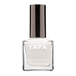 Clear glass bottle of Connie (Color: White) Nail Lacquer | YAPA with black cap featuring a sleek, professional design for premium nail care and polish application.
