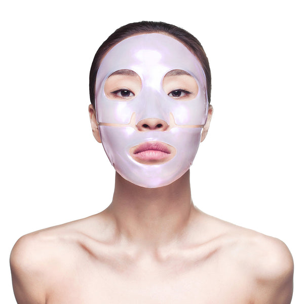 Woman wearing a translucent pearlescent facial sheet mask for skincare and wellness, showcasing the Diamond Radiance Face Mask - 4 Pack | Knesko.